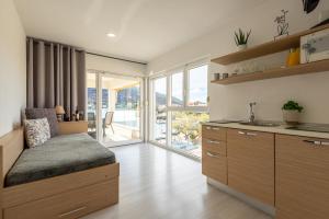 Postel nebo postele na pokoji v ubytování Apartments Holidays Roko