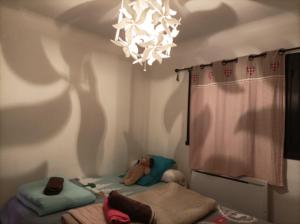 מיטה או מיטות בחדר ב-Gîte - Appartement - sans draps et serviettes