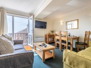 a living room with a couch and a table at 2 Bed in Croyde 87110 in Croyde
