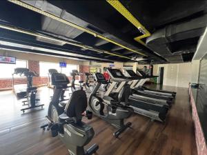 a gym with several treadmills and cardio machines at Your Bright-Cozy&Luxury home Istanbul in Istanbul