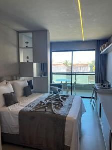 a bedroom with a large bed in a room at Flat 207 Villa del Porto in Porto De Galinhas