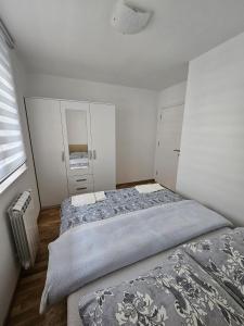 Ένα ή περισσότερα κρεβάτια σε δωμάτιο στο Dream Apartment