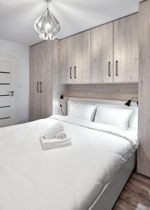 Posteľ alebo postele v izbe v ubytovaní Winogrady Loft Apartment