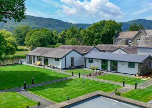 an aerial view of a house with a yard at Rwst Holiday Lodges in Llanrwst