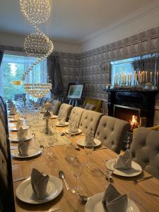 a long table with glasses and napkins on it at Mount Eagle - Sleeps 24 in Limerick