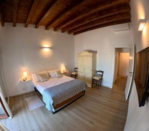 a bedroom with a large bed in a room at Il Palazzino in Taranto