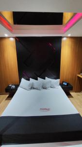 מיטה או מיטות בחדר ב-Motel Exótico Prime - Próximo GRU Aeroporto