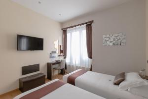 TV a/nebo společenská místnost v ubytování Aiello Rooms - San Babila