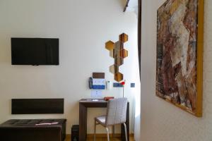 TV a/nebo společenská místnost v ubytování Aiello Rooms - San Babila