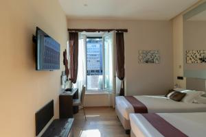 TV a/nebo společenská místnost v ubytování Aiello Rooms - San Babila
