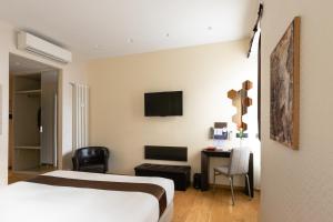 Postel nebo postele na pokoji v ubytování Aiello Rooms - San Babila