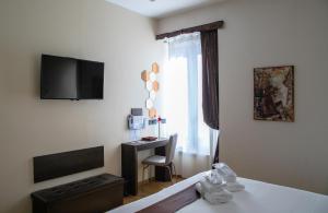 TV a/nebo společenská místnost v ubytování Aiello Rooms - San Babila