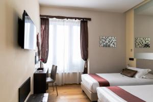 Postel nebo postele na pokoji v ubytování Aiello Rooms - San Babila