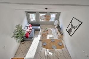 an overhead view of a living room with a table at LE NOE - AC CLiM - Wi-Fi in Avignon