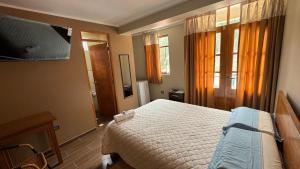 Μια τηλεόραση ή/και κέντρο ψυχαγωγίας στο Hostal Tinkoj