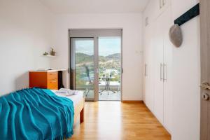 En eller flere senge i et værelse på Barbara Apartment