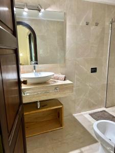 a bathroom with a sink and a mirror at Beautiful Chalet Punta del Este in Punta del Este