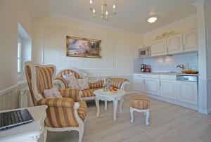 a living room with a couch and a table at Villa Katharina in Sassnitz