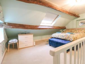 Katil atau katil-katil dalam bilik di Yew Tree Cottage