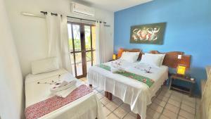Postel nebo postele na pokoji v ubytování Pousada Igarakuê Flat + 37 fotografií
