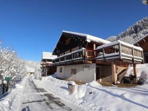 a house with a deck in the snow at Chalet Arêches-Beaufort, 5 pièces, 8 personnes - FR-1-342-243 in Beaufort