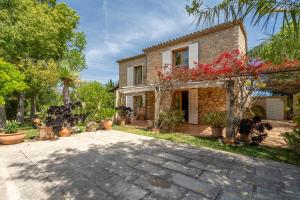 a stone house with a courtyard in front of it at Selva - 4101 Mallorca in Selva