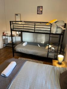 a room with two bunk beds and a bed at Rooms Anfield- 5 mins from LFC in Liverpool
