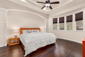 a bedroom with a bed and a ceiling fan at Randolph Central Location, 1-story, Chef Kitchen, Creekside in Selma