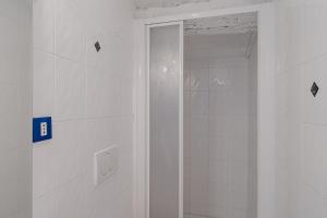 a shower with a glass door in a bathroom at Pied-a-terre Saint Michel in Menton
