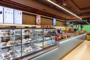 a bakery with a display case filled with food at Marriott Executive Apartments Istanbul Fulya in Istanbul