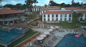 an aerial view of a resort with two swimming pools at Quinta Santa Bárbara in Pirenópolis