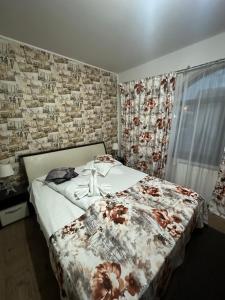 Postel nebo postele na pokoji v ubytování Pensiunea Casa Simoni