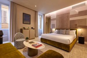 Postel nebo postele na pokoji v ubytování Borghese Contemporary Hotel