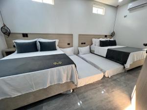 Ein Bett oder Betten in einem Zimmer der Unterkunft HOTEL MASS LUXURY