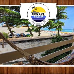 a picture of a hammock on a beach at Suítes a 15 metros da praia in Marechal Deodoro