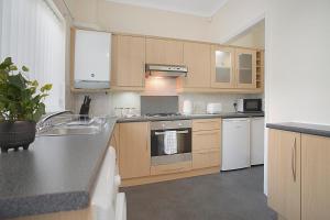 a kitchen with a sink and a stove top oven at Falmer Serene Getaway, Newly Refurbished, Sleeps 4 in Darlington