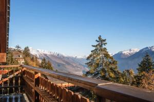 a view of the mountains from the balcony of a house at Magnificent flat in Crans-Montana - 856 in Crans-Montana