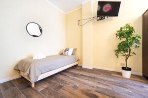 A bed or beds in a room at Appartamenti Vista Mole, Centro a 15 min - Luxury Suites & fast WiFi