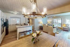 a large living room with a dining room and kitchen at Dulany at the Gondola in Steamboat Springs