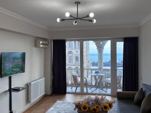 a living room with a view of a building at Sea view Residence in Baku