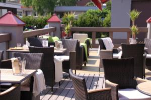 a row of tables and chairs on a patio at Loimaan Seurahuone in Loimaa