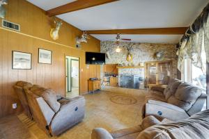 a living room with two couches and a tv at Rustic and Western House on Lake - Swim, Fish, Hunt! in Llano
