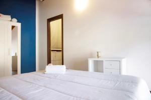 Postel nebo postele na pokoji v ubytování Relax Tra Monti e Laghi