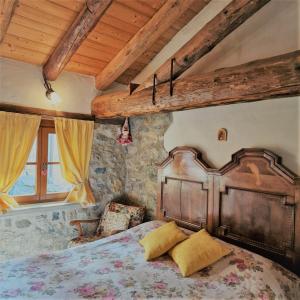 a bedroom with a wooden bed in a room at B&B Santa Brigida in Santa Brigida