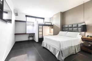 Hotel Cartagena DC客房内的一张或多张床位