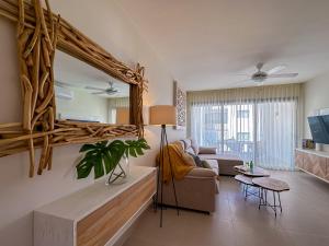 a living room with a large mirror on the wall at Perfect holiday getaway at the beach in Punta Cana
