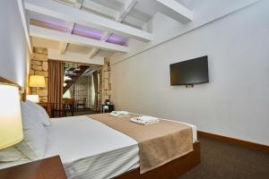 Postel nebo postele na pokoji v ubytování DEM Hotel + 37 fotografií