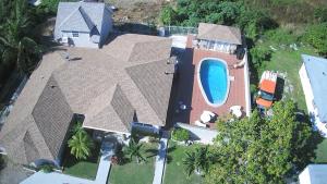 an aerial view of a house with a swimming pool at Cocoplum Rest N Hideaway #2 in Nassau