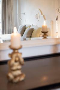 A bed or beds in a room at Corso Emanuele Apartments