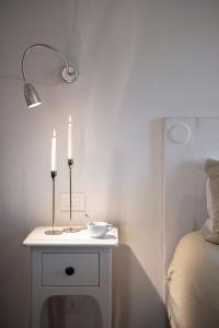 A bed or beds in a room at Corso Emanuele Apartments
